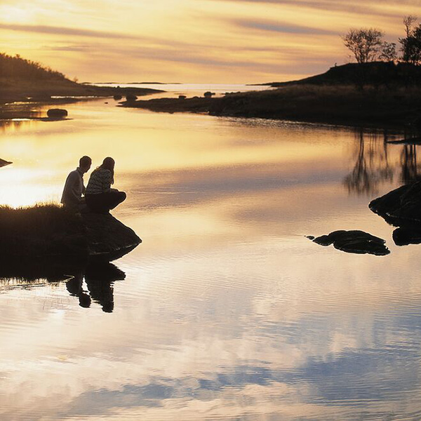 "Couple enjoying the midnight sun in Bodø"