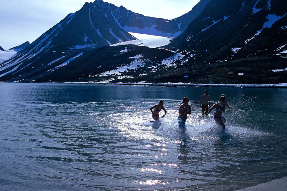 "Group icebathing in the sea near Svalbard"