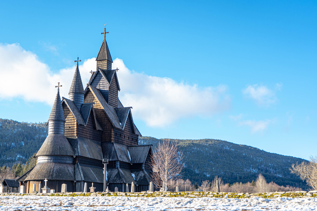 Large wooden church with crosses on the roof